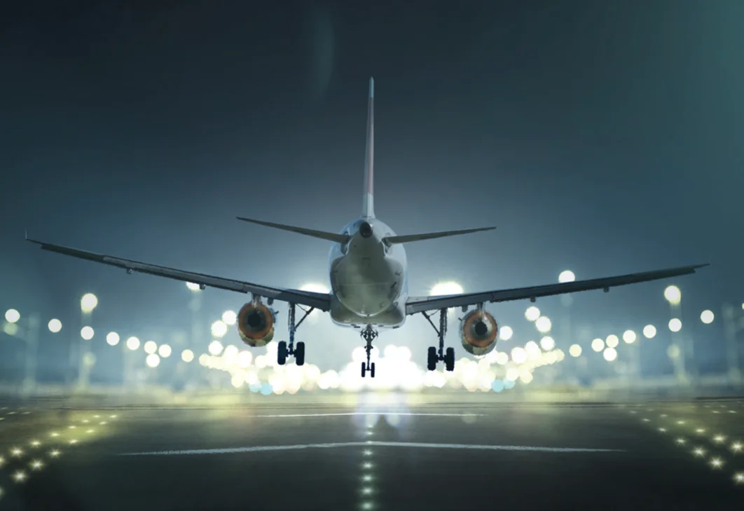 A jumbo liner landing on the runway.